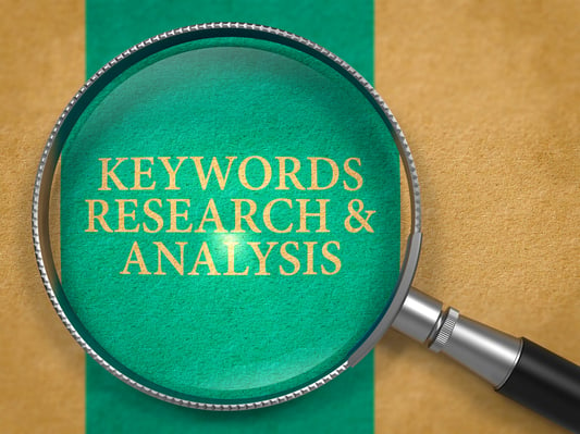 Keywords Research and Analysis through Loupe on Old Paper with Blue Vertical Line Background.